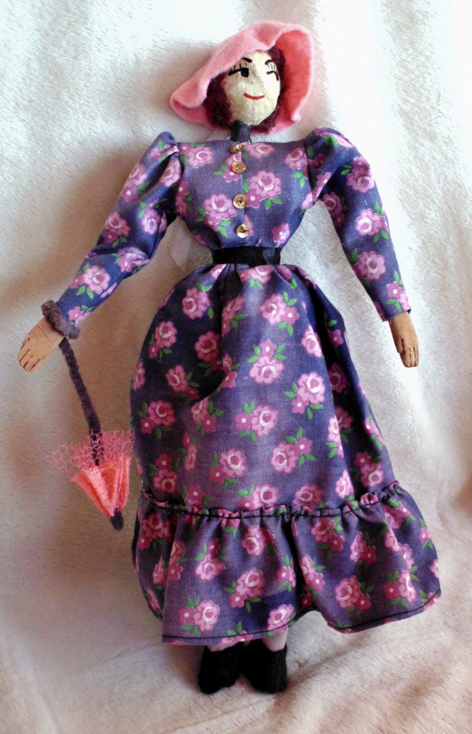 Handmade vintage doll in pioneer dress with parasol