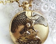 American Eagle Pocket Watch in gold tone. ...