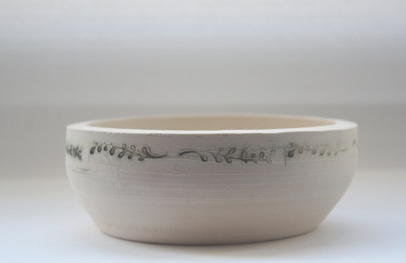 Stoneware vessel handthrown with embossed branches by madebymanos