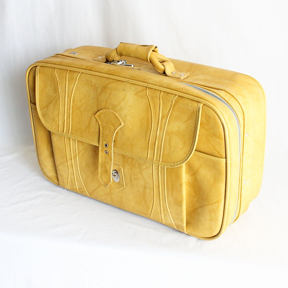 yellow small suitcase