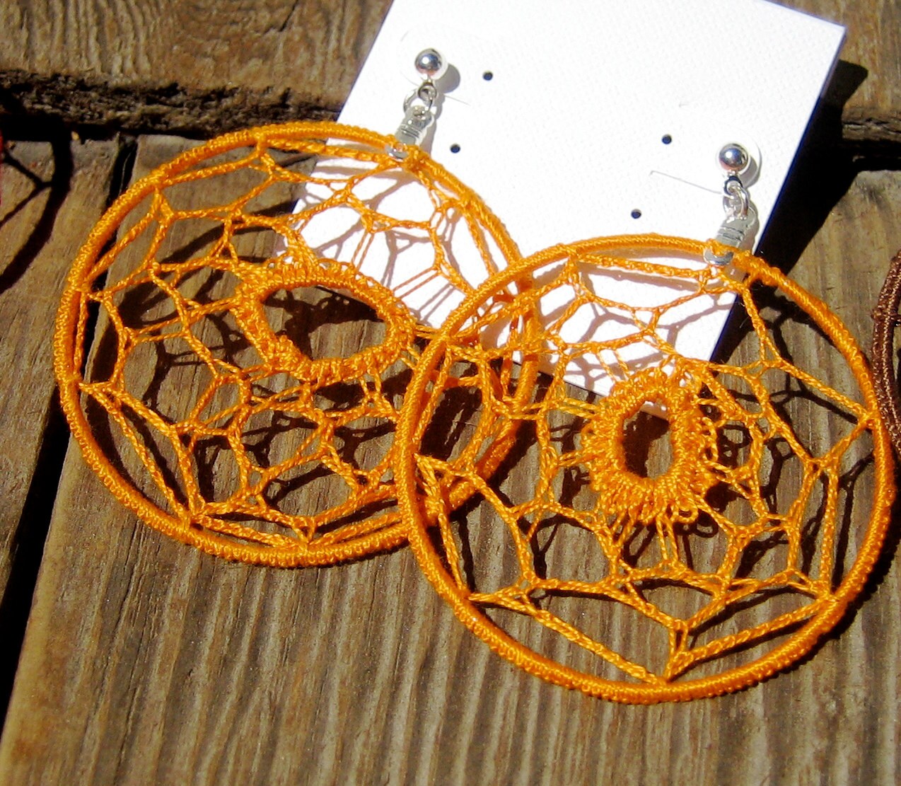 loops Unique orange crocheted earrings.