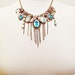 Vintage Assemblage Necklace Cameo Charm Glass Cameos Statement Aqua Blue Rhinestone Gold Coins VintElegance