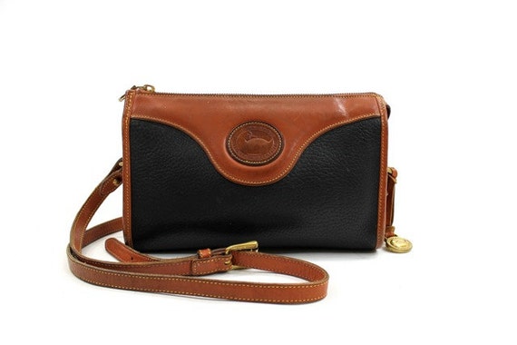 Dooney & Bourke black and brown leather cross body bag / two