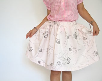 girls skirt, floral print on pale pink, two pockets, 6 year old girl