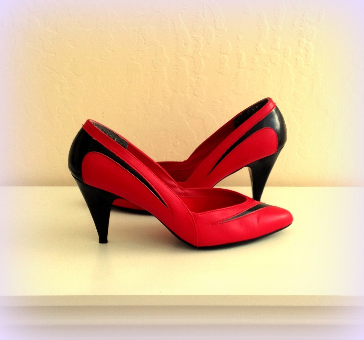 red and white spectator pumps