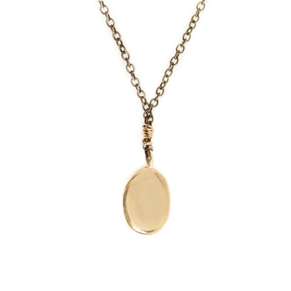 necklace with golden beach pebble shaped pendant