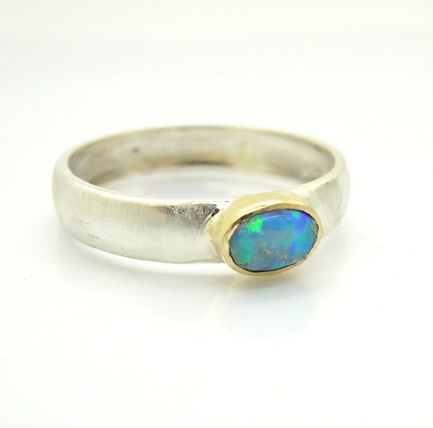 Opal ring set in yellow gold and sterling silver by HadasGold