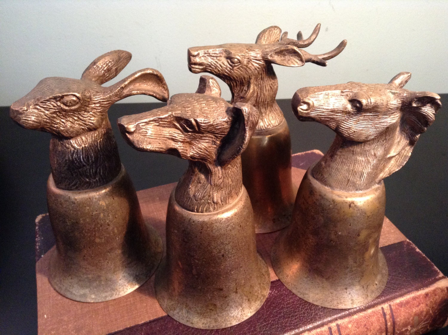 Set of four Vintage brass animal head stirrup cups or trophy