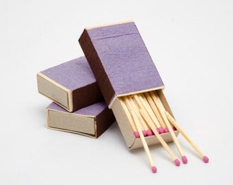 Three matchboxes, wooden matches with pink heads inside, striker from two sides, color matchsticks