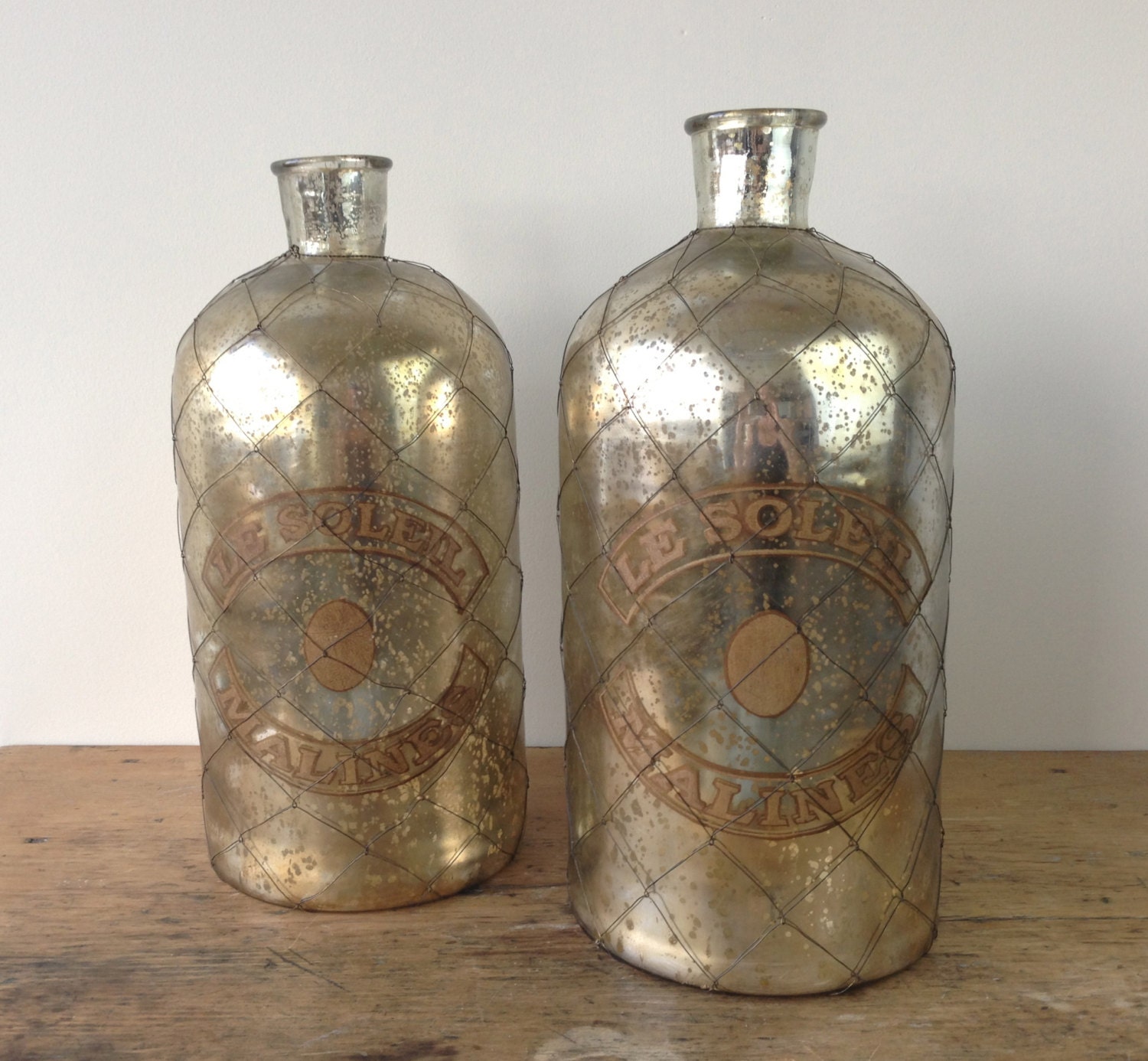 pair of large mercury glass bottles pair of large mercury glass bottles
