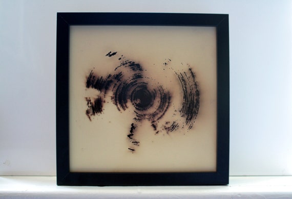 Laser cut circular design with burning effect by madebymanos