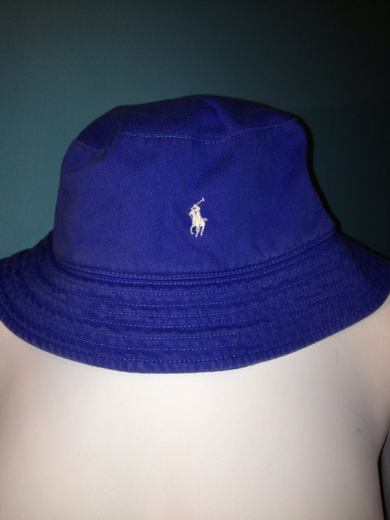 white and blue polo hat