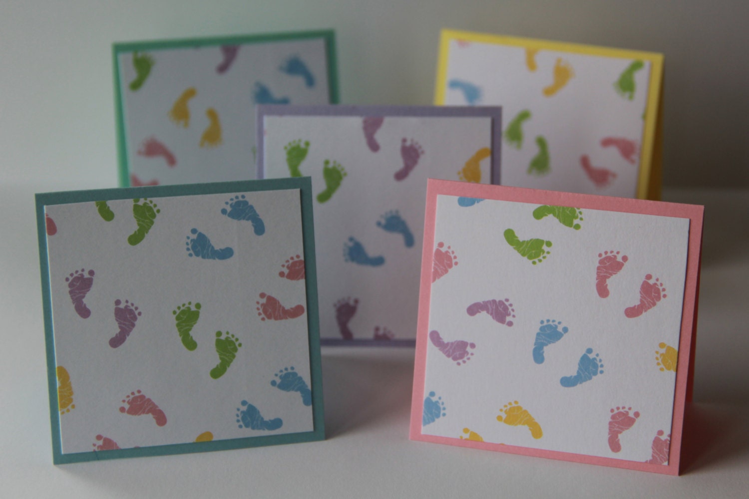 Multicolored Baby footprint cards