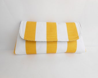 yellow and white clutch