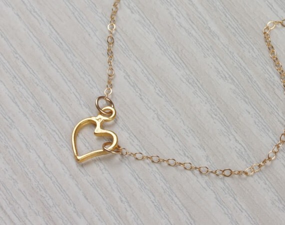 Tiny Heart necklace gold heart necklace sideways by OlizzJewelry