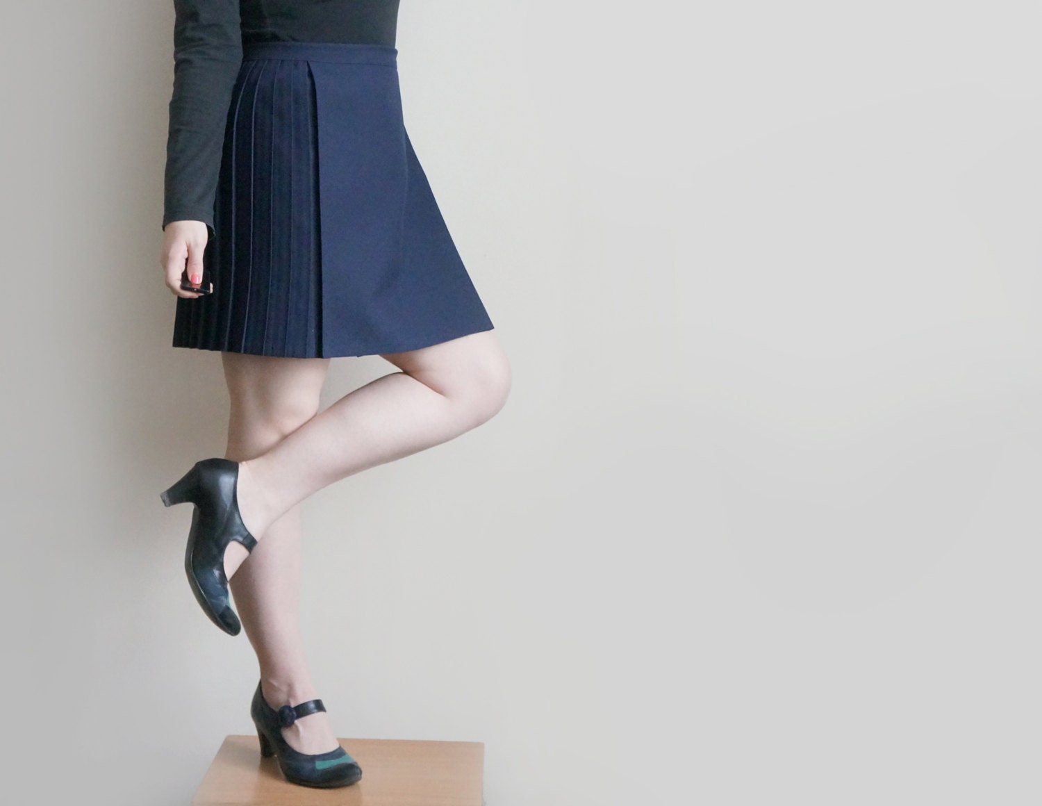 Vintage navy blue mini skirt in retro style, school uniform navy