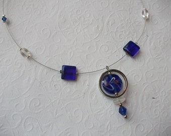 Blue lampwork pendant and floating beads silver wire necklace