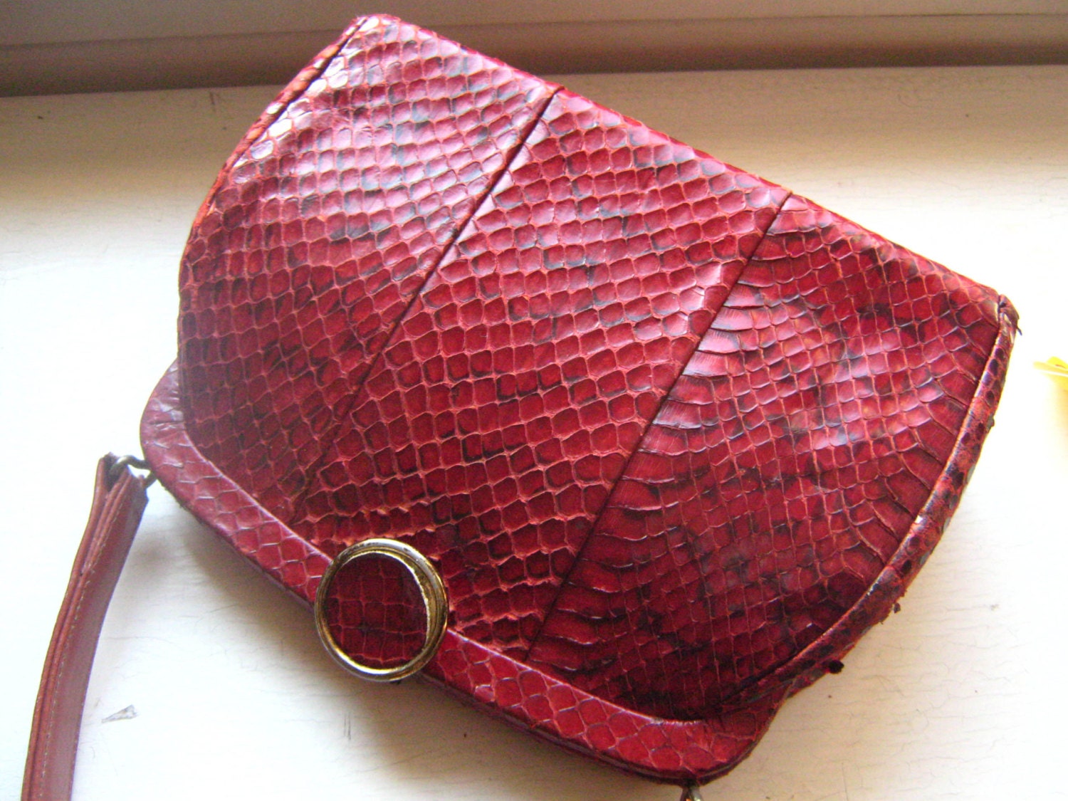 red snakeskin purse