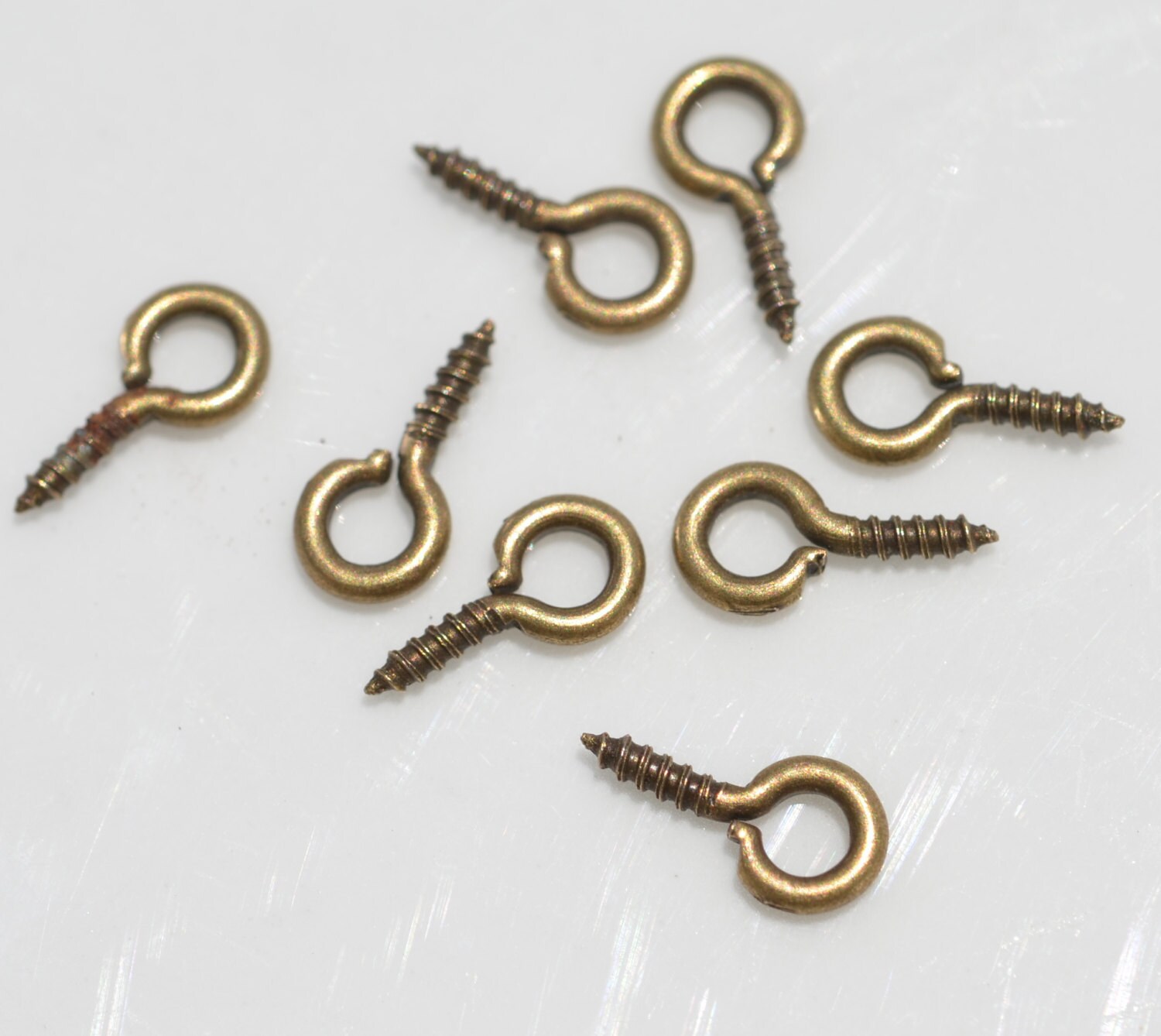 100 Antique Bronze 9mm Screw Eyes F163 by LorettasBeads on Etsy
