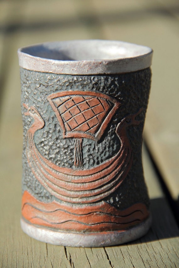 Viking mead or coffee cup with carved pattern of a Viking ship