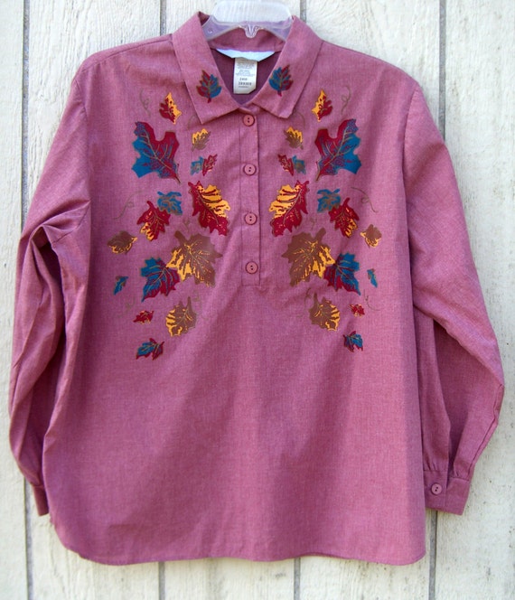 Cranberry colored shirt with fall leaves.