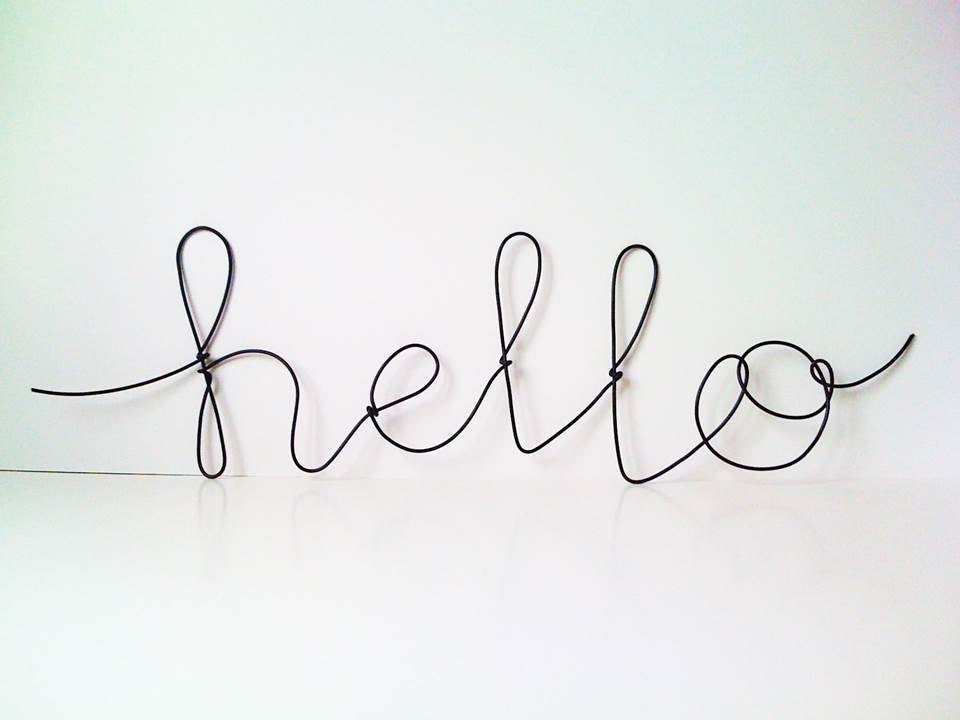 Black hello plastic covered cursive wire wall word