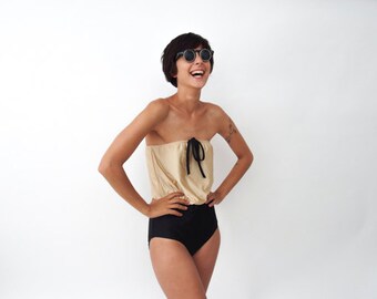 One Piece swimsuit in Gold and Black with Strapless Cleavage in Retro Style