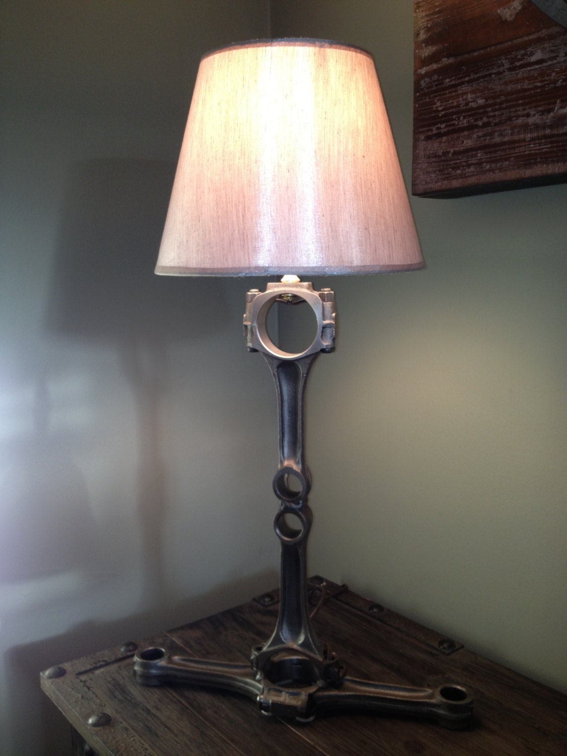 Hand crafted table lamp using repurposed engine/car parts.