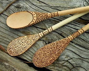 Wood-burned wooden spoon with scrolls and vines