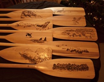Woodburned canoe paddles and art pi eces 