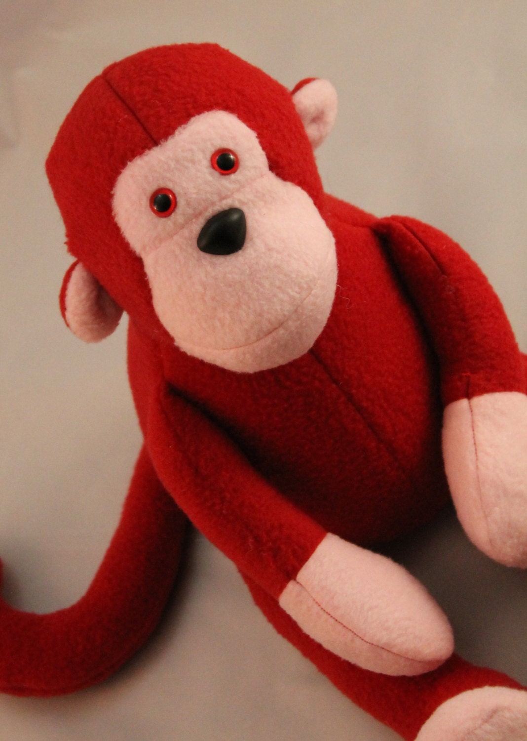 stuffed red monkey