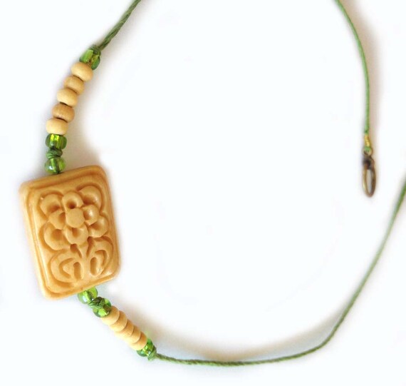 Items similar to Hemp Cord Necklace With Rectangular Carved Bone Flower