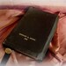 vintage leather bound lutheran hymn book . black leather with gold imprinted name and date 1935 . lutheran ss book mark