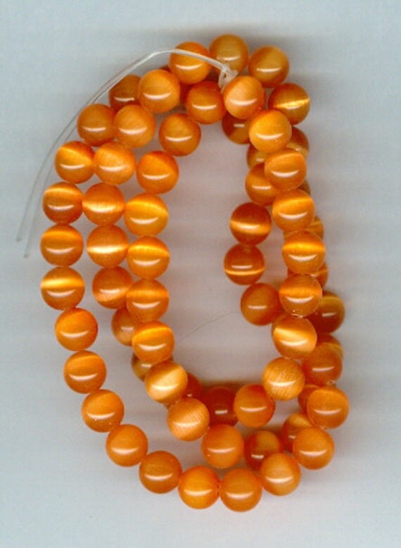 RESERVED Set 2 6mm Orange Cats Eye Beads by RockNBeads on Etsy