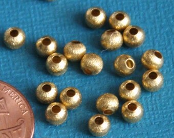 100 pcs of Gold plated round brush beads 4mm