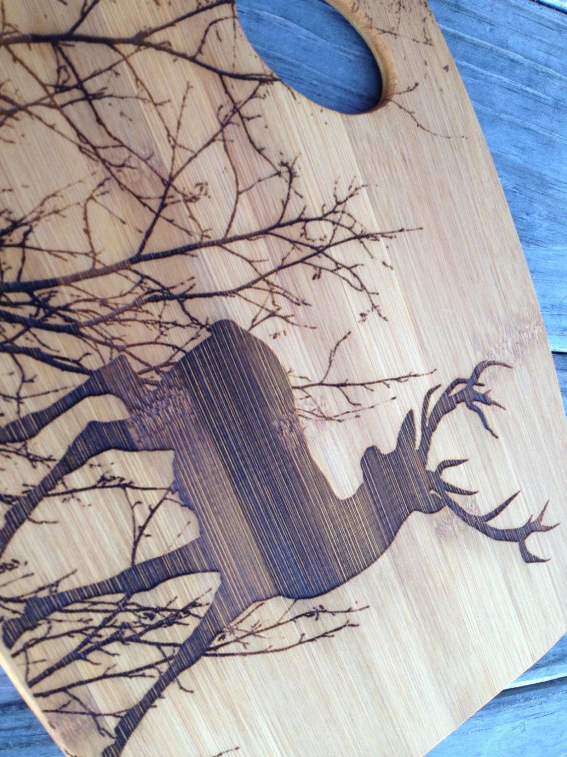 Custom Deer and trees engraved cutting board by customcoinrings