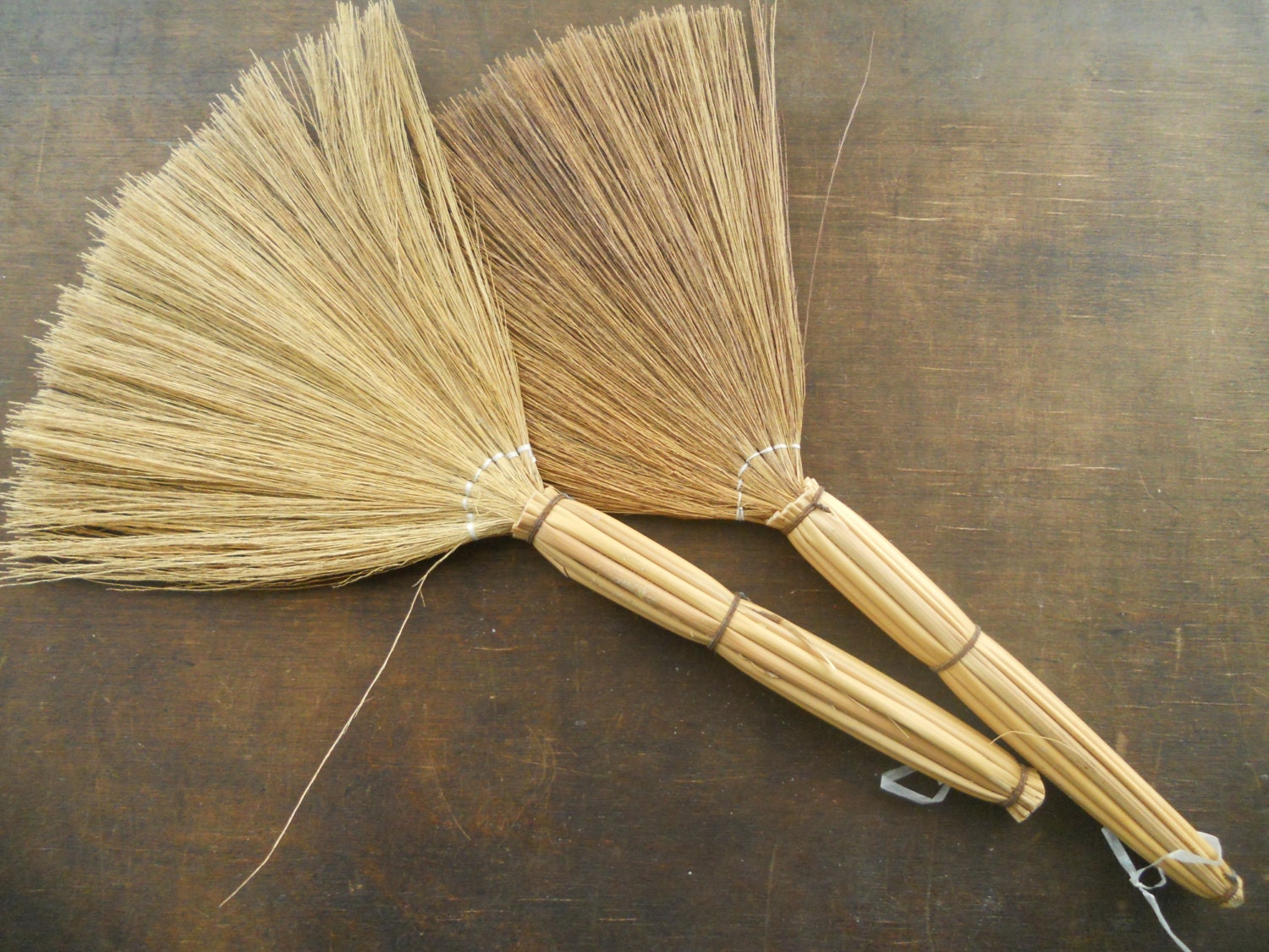 colored straw brooms