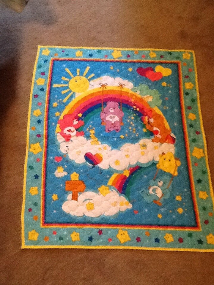 Care Bears reversible baby blanket. Back side is blue with