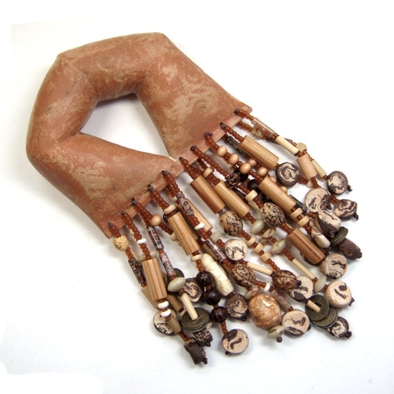 U -Shape Ceremonial Rattle heavily Adorned with Clay, Wood, Horn and Seed Bead Fringe