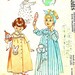 Vintage 1950s McCalls 2303 printed pattern for childs robe with transfer of bunny and flower.