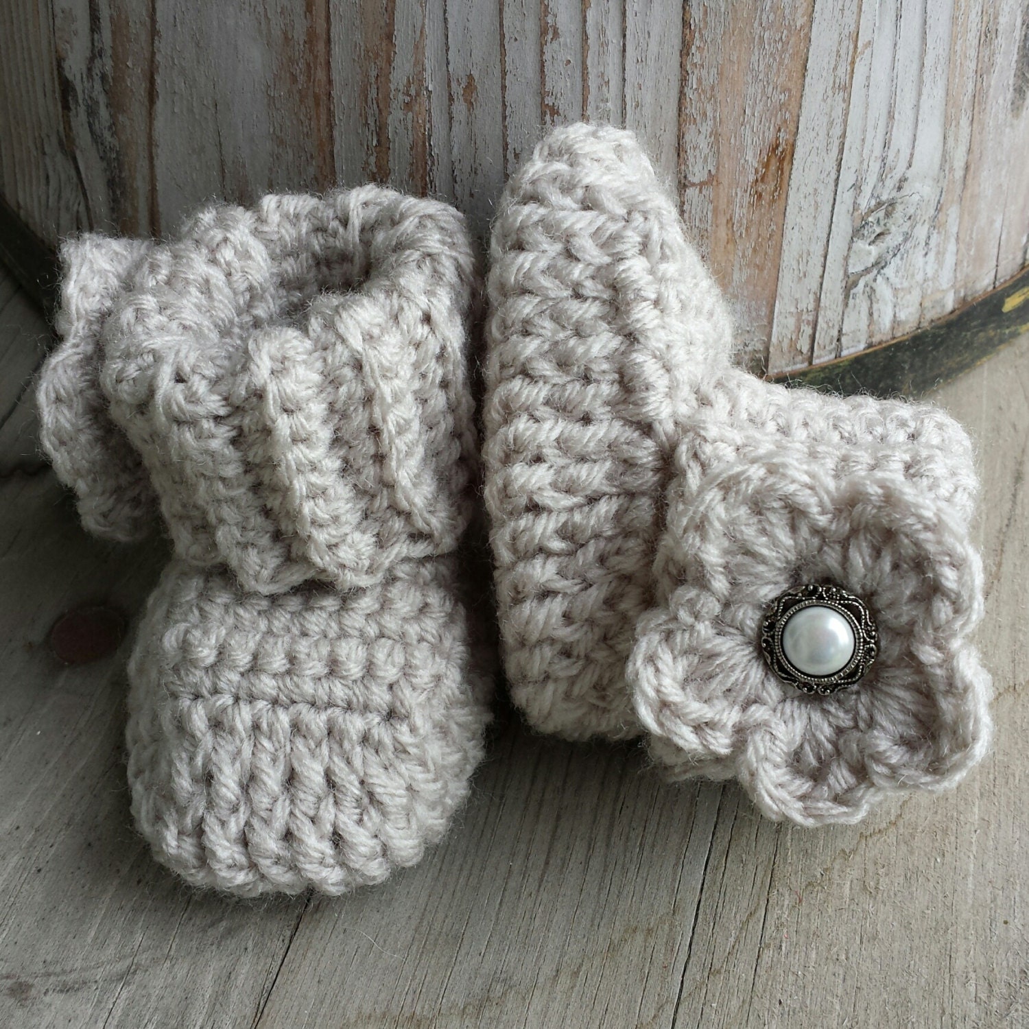 Crochet baby girl boots in oatmeal with matching flower and