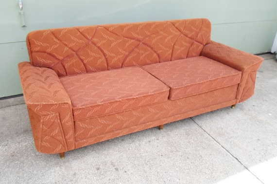 late 60s vinyl sofa bed orange