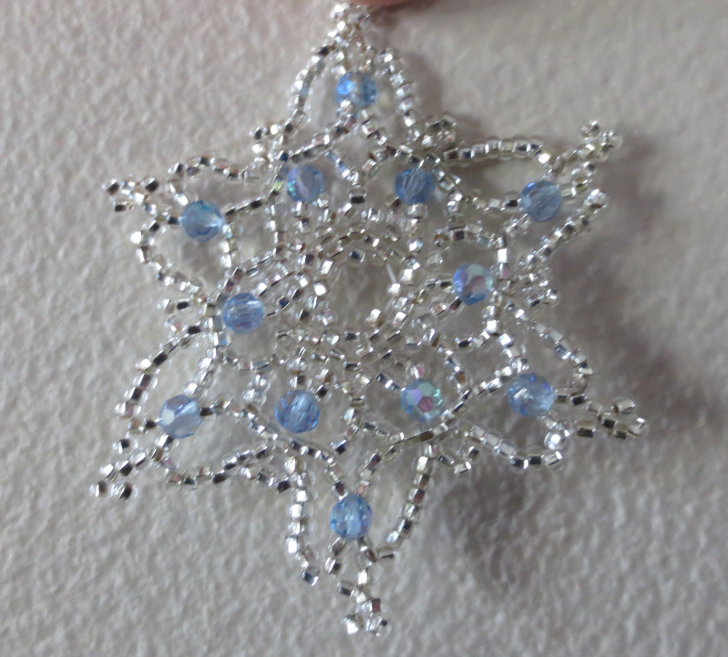 Bead and crystal snowflake / wreath ornament.