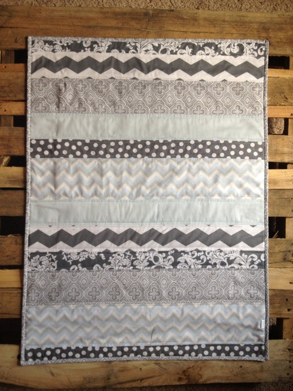 Baby blue and grey striped quilt