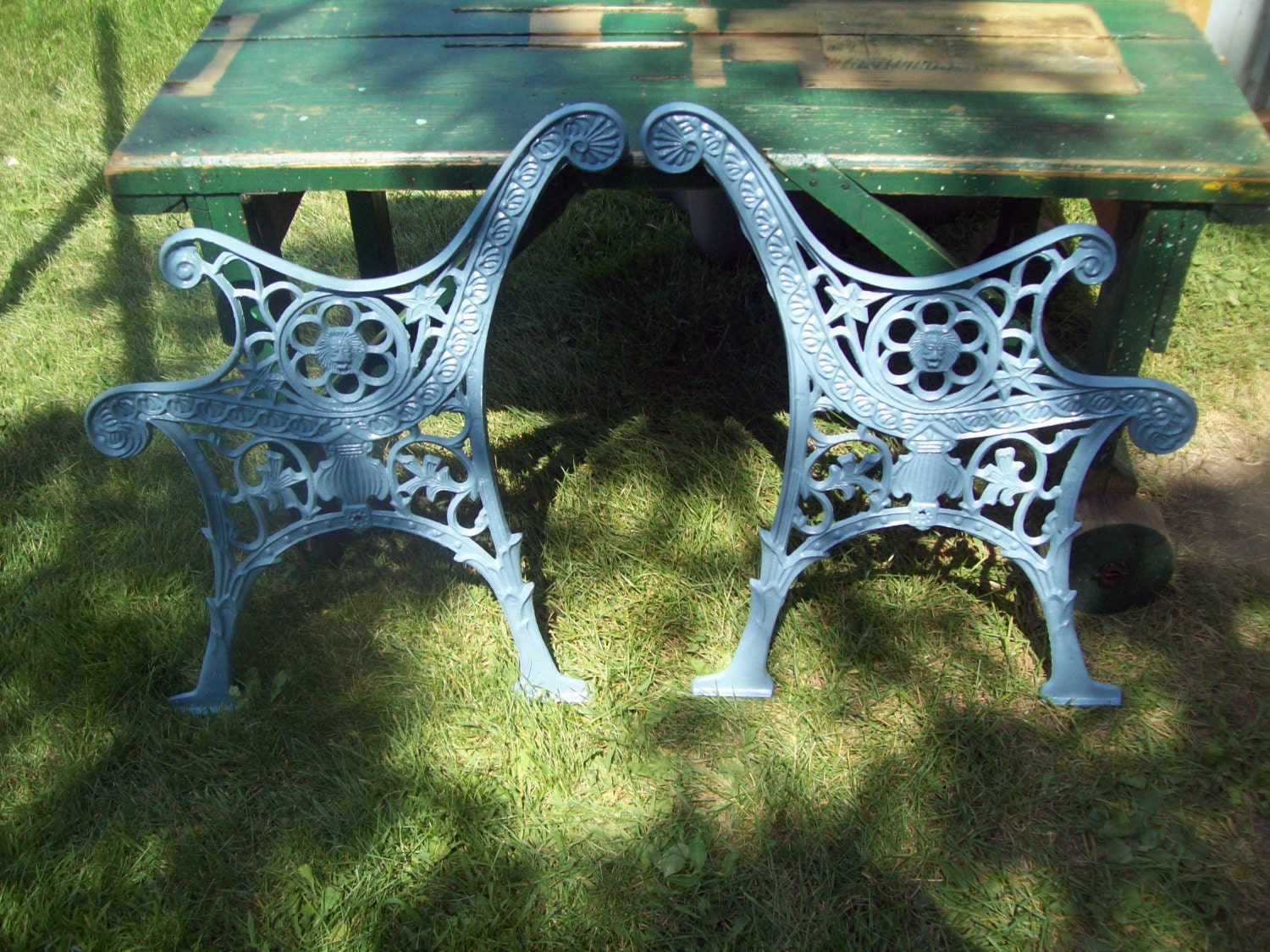 Vintage cast iron park bench ends with lions head