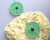 Crocheted earring, green dreamcahtcher style with black bead in the middle