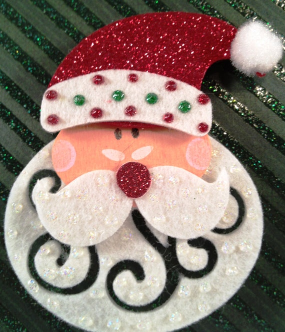 Whimsical Santa Face pin is made of felt. by RockinRobinsBling