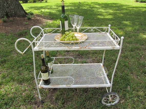 https://www.etsy.com/listing/162903206/vintage-tea-trolleymetal-cartshabby-chic?ga_order=most_relevant&ga_search_type=all&ga_view_type=gallery&ga_search_query=v2%20v2team%20garden%20decor&ref=sr_gallery_2