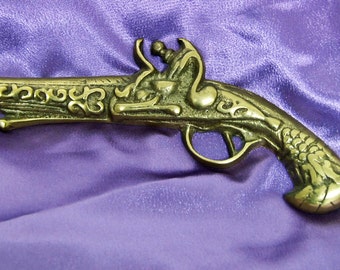 Solid cast brass wall hanging flintlock pistol