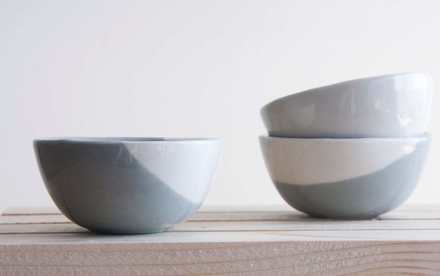 Set of three little bowls in concrete gray and white with